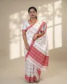White Toss mekhela sador jura with red full body xoru phul buta, self pari, and red woven lower work