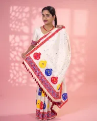 White Toss mekhela sador jura with colourful bindi buta, broad kalka phul lower-end design, and unstitched contrast pari