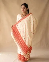White Toss mekhela sador jura with red full body xoru phul buta, self pari, and red woven lower work
