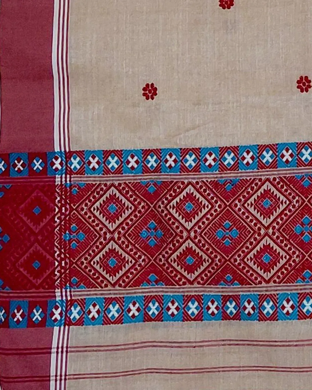 Kola Toss silk single sador with red buta, maroon side pari, and red blue Mising border