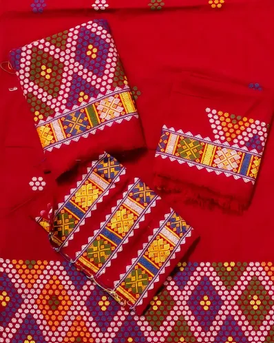 Red Mising mekhela sador jura with blouse piece, colourful guti phul, Mising ghai phul, and Mising pari