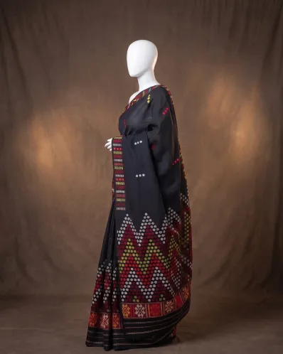 Black Mishing mekhela sador jura with blouse, self pari, and colourful Mising phul work