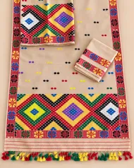 Golden Toss mekhela sador with blouse piece, colourful jora buta, Mising ghai phul, Mising pari, and tassel finish