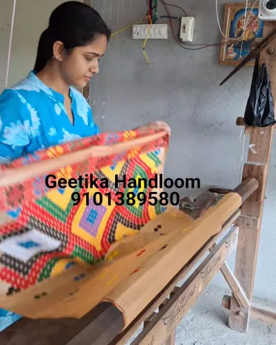 Golden Toss mekhela sador with blouse piece, colourful jora buta, Mising ghai phul, Mising pari, and tassel finish