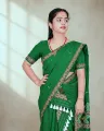 Green Mising mekhela sador with blouse piece, guti phul buta, Mising ghai phul, Mising pari, and white tassels