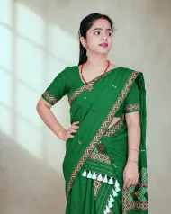 Green Mising mekhela sador with blouse piece, guti phul buta, Mising ghai phul, Mising pari, and white tassels