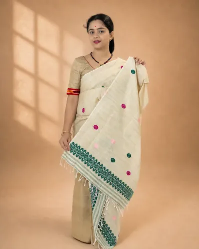 Natural beige ghisa cotton single sador with green and pink motifs, ghai phul, and dohi
