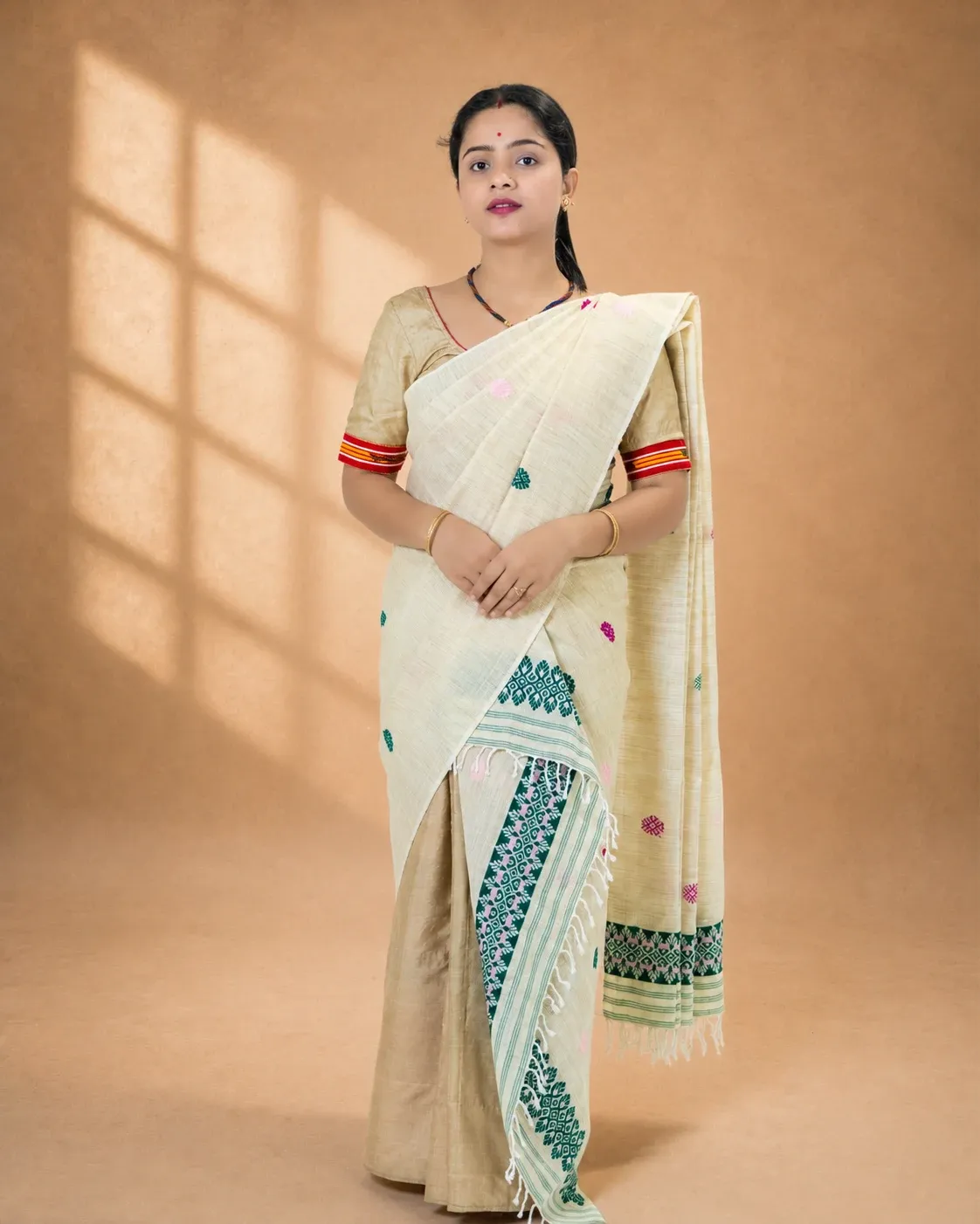 Natural beige ghisa cotton single sador with green and pink motifs, ghai phul, and dohi