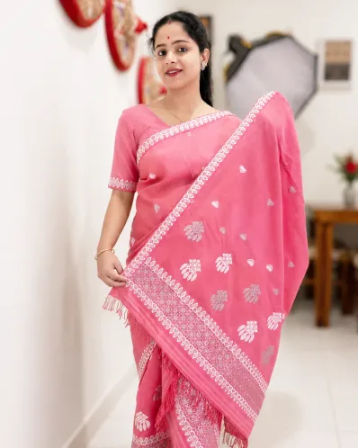 Pink Kesa Paat cotton mekhela sador jura with silver-white xoru phul buta, gos pata buta, broad ghai phul, xoru phul pari, and matching blouse