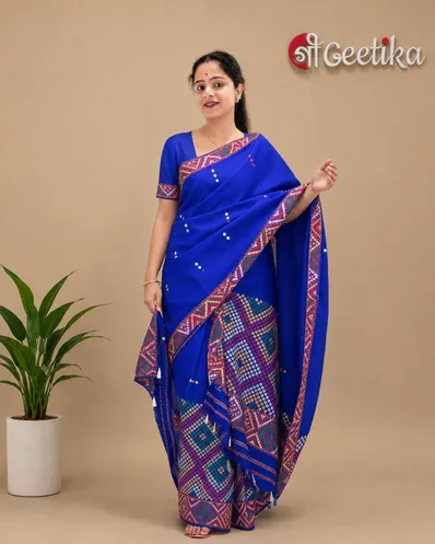 Blue Mising mekhela sador jura with colourful guti phul, Mising ghai phul, broad Mising pari, parboti work, and matching blouse piece