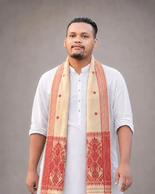 Handwoven Assamese Toss Gamosa featuring traditional red motifs