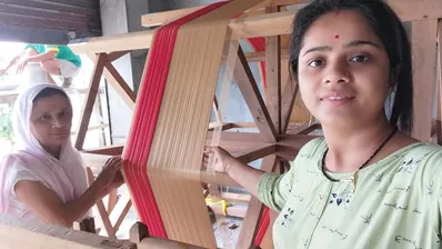 Toss silk threads beautifully arranged for Taat Bati on an Assamese handloom