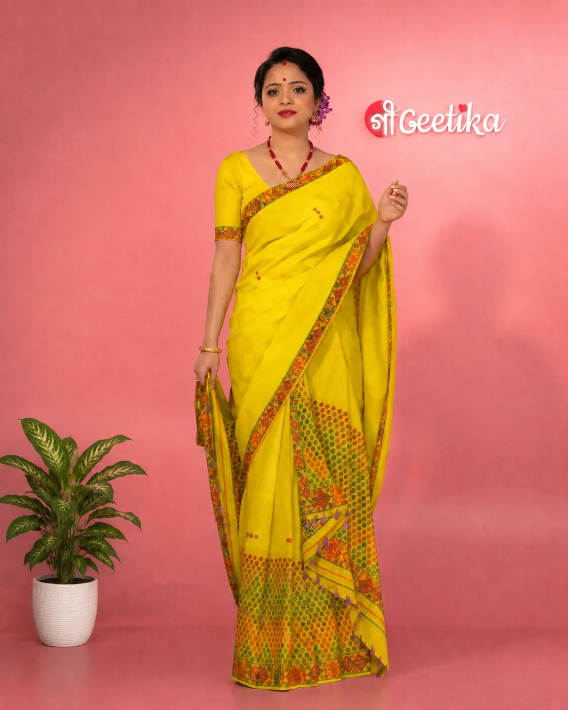 Yellow Mising mekhela sador jura with blouse piece, colourful guti phul, Mising ghai phul, and Mising pari