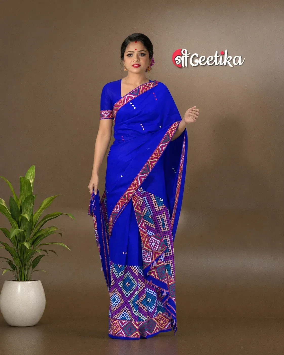 Blue Mising mekhela sador jura with colourful guti phul, Mising ghai phul, broad Mising pari, parboti work, and matching blouse piece